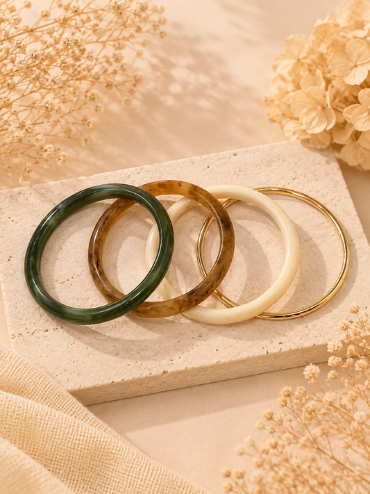 Lot de 4 bracelets joncs en résine couleur marbré, ambré et doré