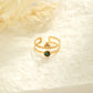 Bague double ligne avec triple boule et perle verte
