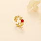 Leaf and red stone outline ring