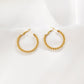 Braided hoop earrings with white stones