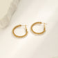 Braided hoop earrings with white stones