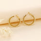 Braided hoop earrings with white stones