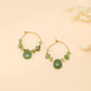 Boucles d'oreilles créoles avec pierres vertes
