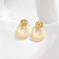 Boucles d'oreilles martelé avec anneaux blancs