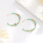 Boucles d'oreilles créoles et perles vertes