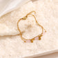 Bracelet dorée avec pendentif et perles roses