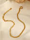 Asymmetrical chain necklace with clasp