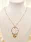 Long necklace with round pendant and sun