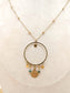 Long necklace with round pendant and sun