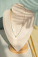Collier perle avec pendentif rond martelé
