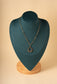 Round pendant necklace and pearls