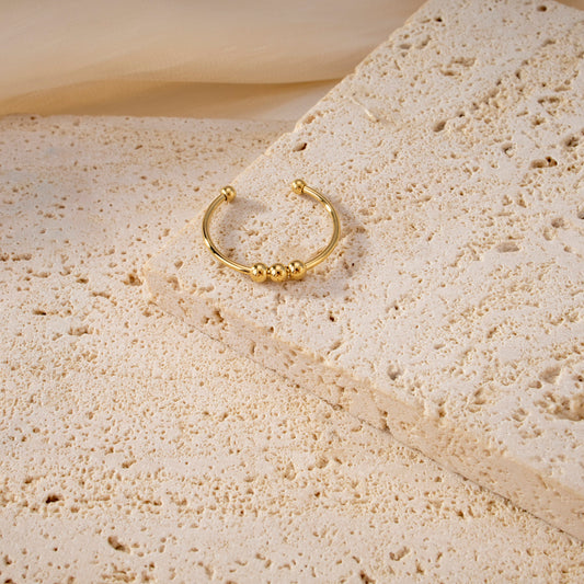 Bague ajustable triple boules dorée