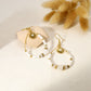 Drop earrings with sun in white stones
