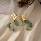 Earring with green stones