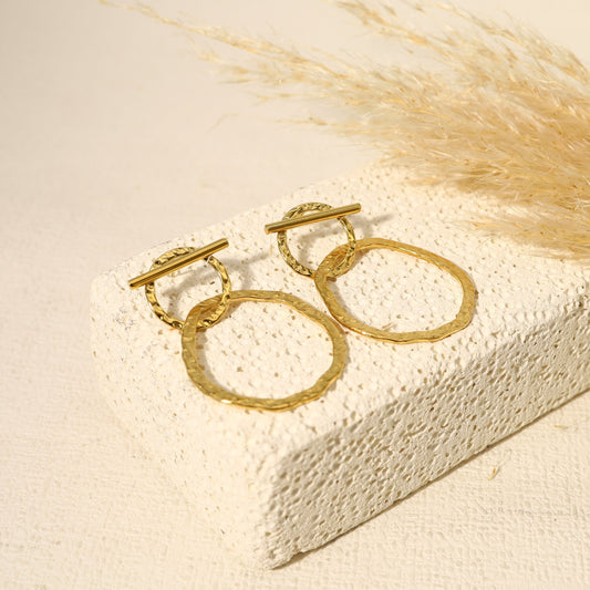 Boucle d'oreilles double cercle dont un barré