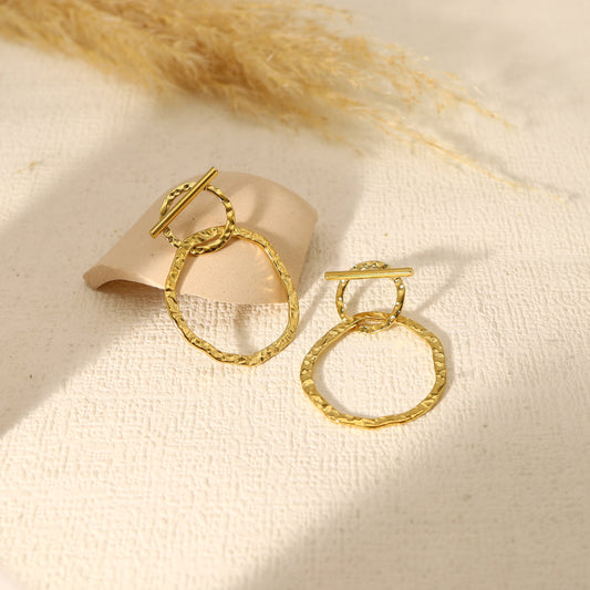 Boucle d'oreilles double cercle dont un barré