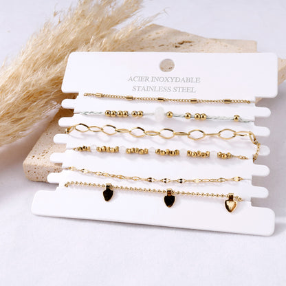 Multiple white thread bracelets