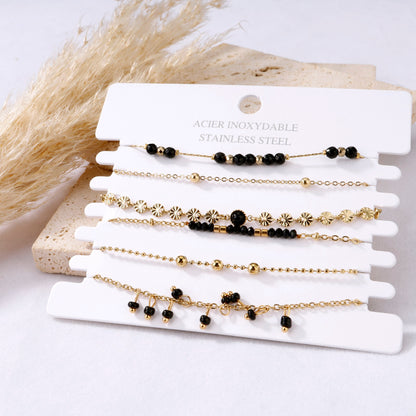 Multiple bracelets black flowers