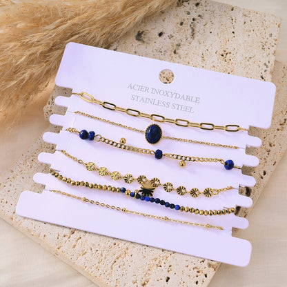 Multiple navy bracelets with stones