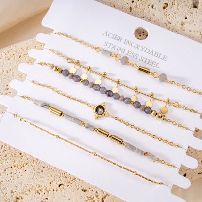 Multiple bracelets gray pearls