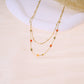 Double chain necklace with small orange beads