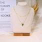 Double chain necklace with green pendants