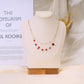 Collier double chaîne avec 8 pierres rouges