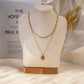 Double chain necklace with pendant and colored stone