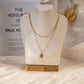 Double chain necklace with pendant and colored stone