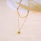 Double chain necklace with pendant and colored stone