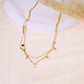 Collier double chaîne avec pierres grises