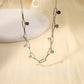 Silver link necklace with round hammered pendants
