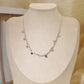 Silver link necklace with round hammered pendants
