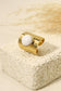 Wide ring with white stone