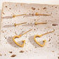 Triple pair of heart hoop earrings