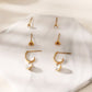 Triple pairs of earrings with dangling rhinestones