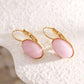 Dangling oval pink stone earrings
