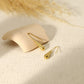 Gold dangling drop earrings