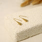 Gold dangling drop earrings