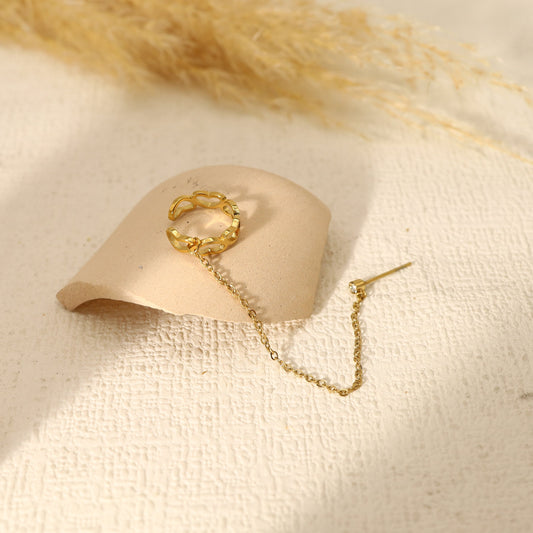 Ears cuff ring linked by a chain to a single rhinestone loop