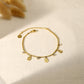 Flat bracelet with hammered drop pendants and rhinestones