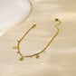 Flat bracelet with hammered drop pendants and rhinestones
