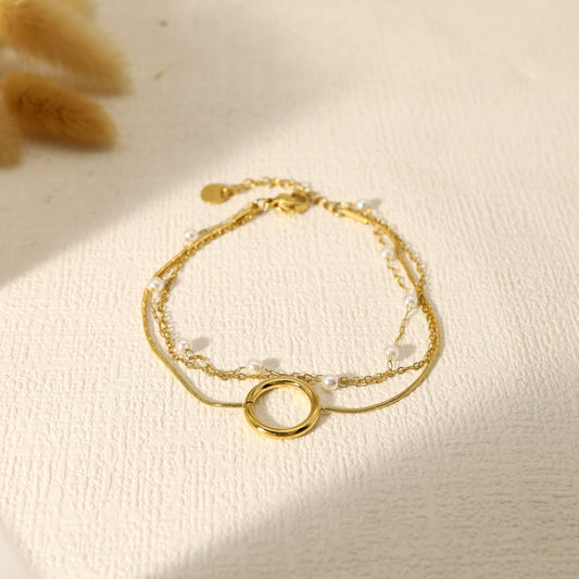 Bracelet triple chaînes anneau et perles