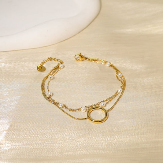 Bracelet triple chaînes anneau et perles