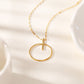 Gold circle and bar necklace