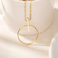 Gold circle and bar necklace