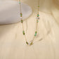 Chain necklace with green and white pearls
