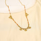 Chain necklace with orange details with round hammered pendants