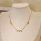Chain necklace with orange details with round hammered pendants