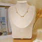 Chain necklace with orange details with round hammered pendants